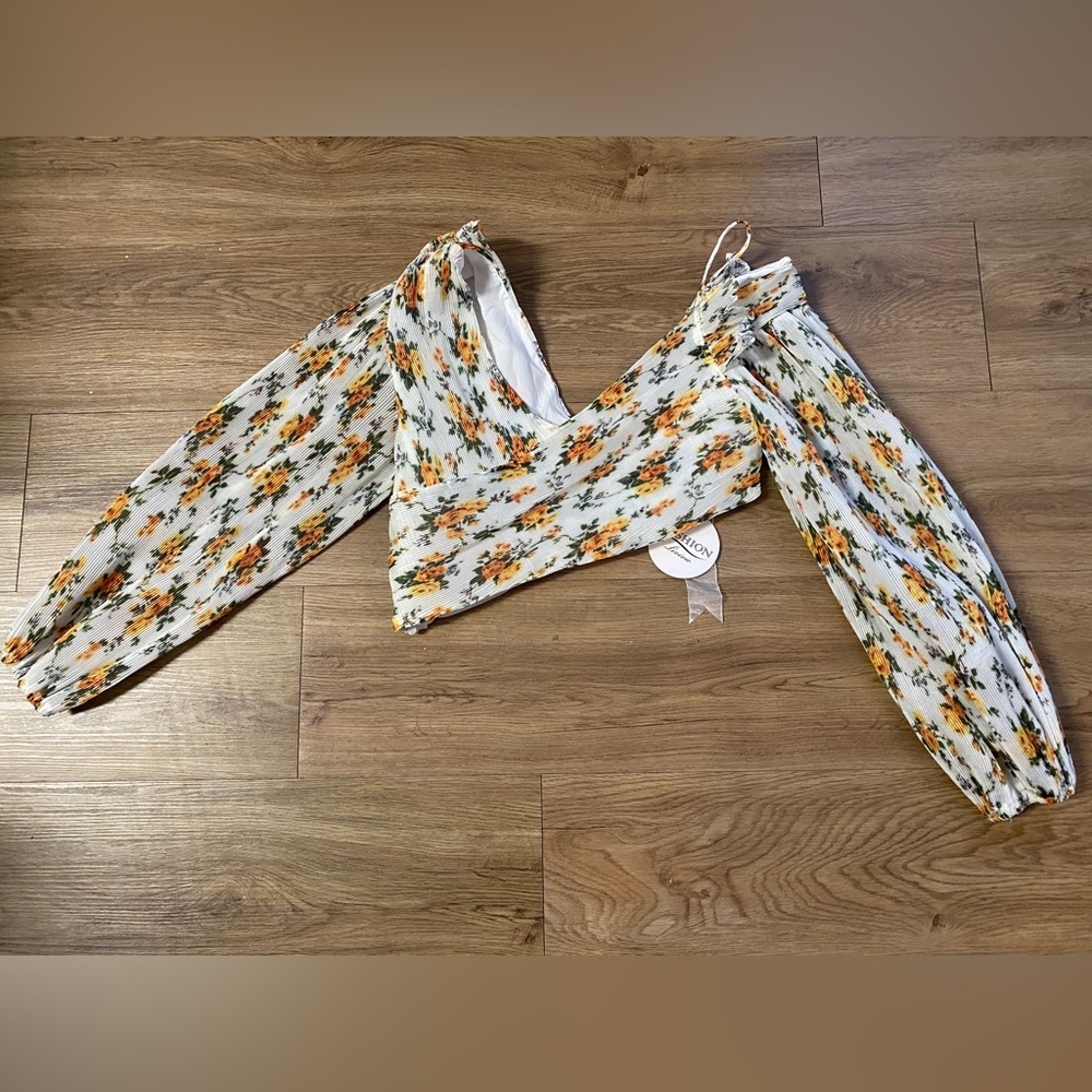 Sexy V-neck pleated Golden Surfer floral-print blouse.